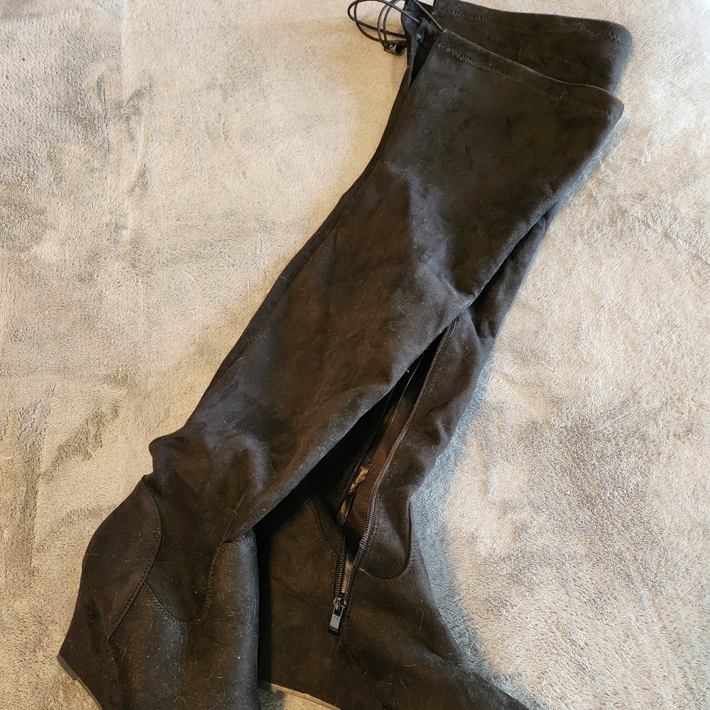 Thigh high black wedge heel boots